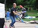 01_0047.JPG: Eeyore's Birthday 2004:  Duaner juggling on uni